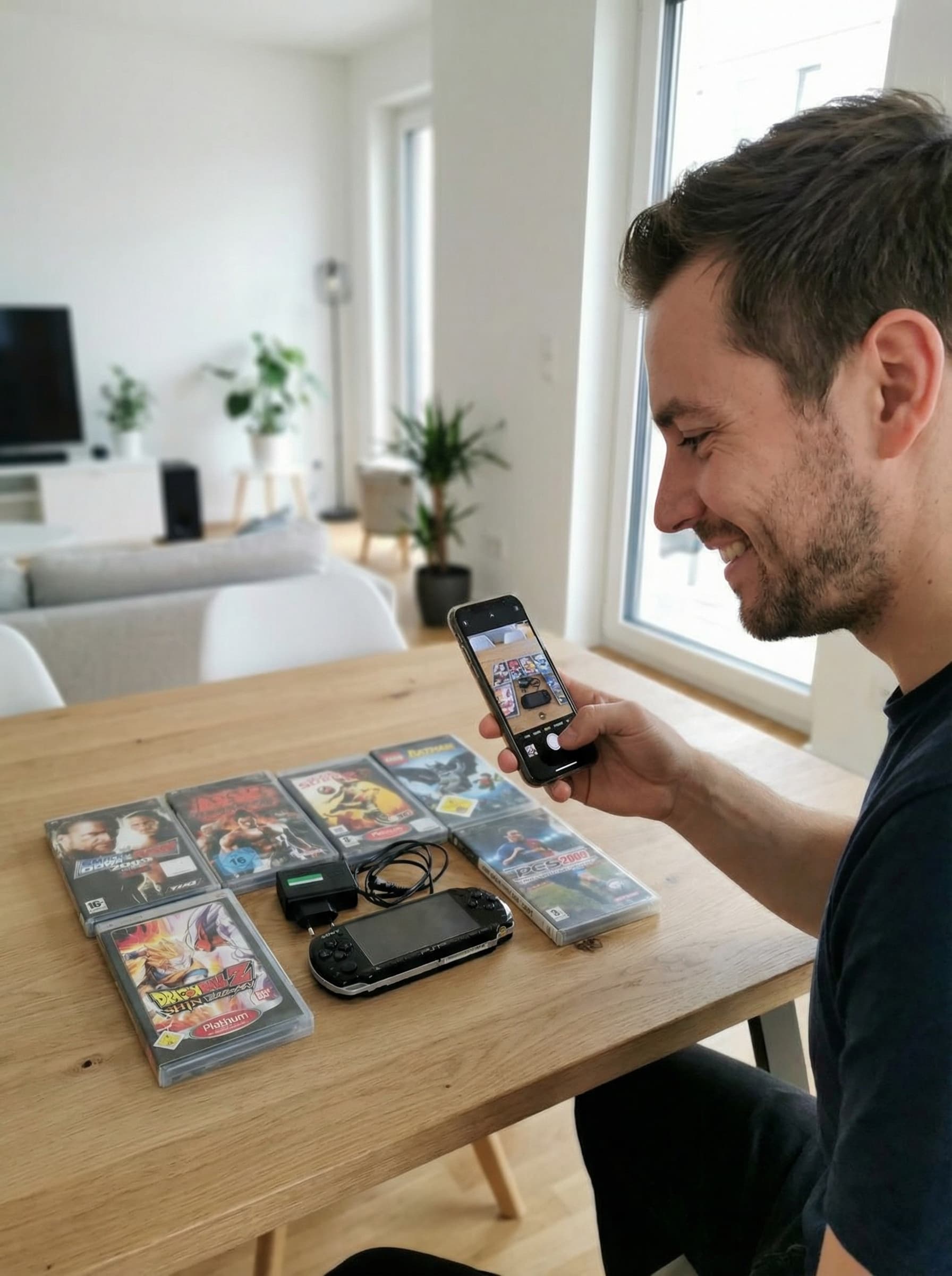 Person fotografiert eine PlayStation Portable Sammlung