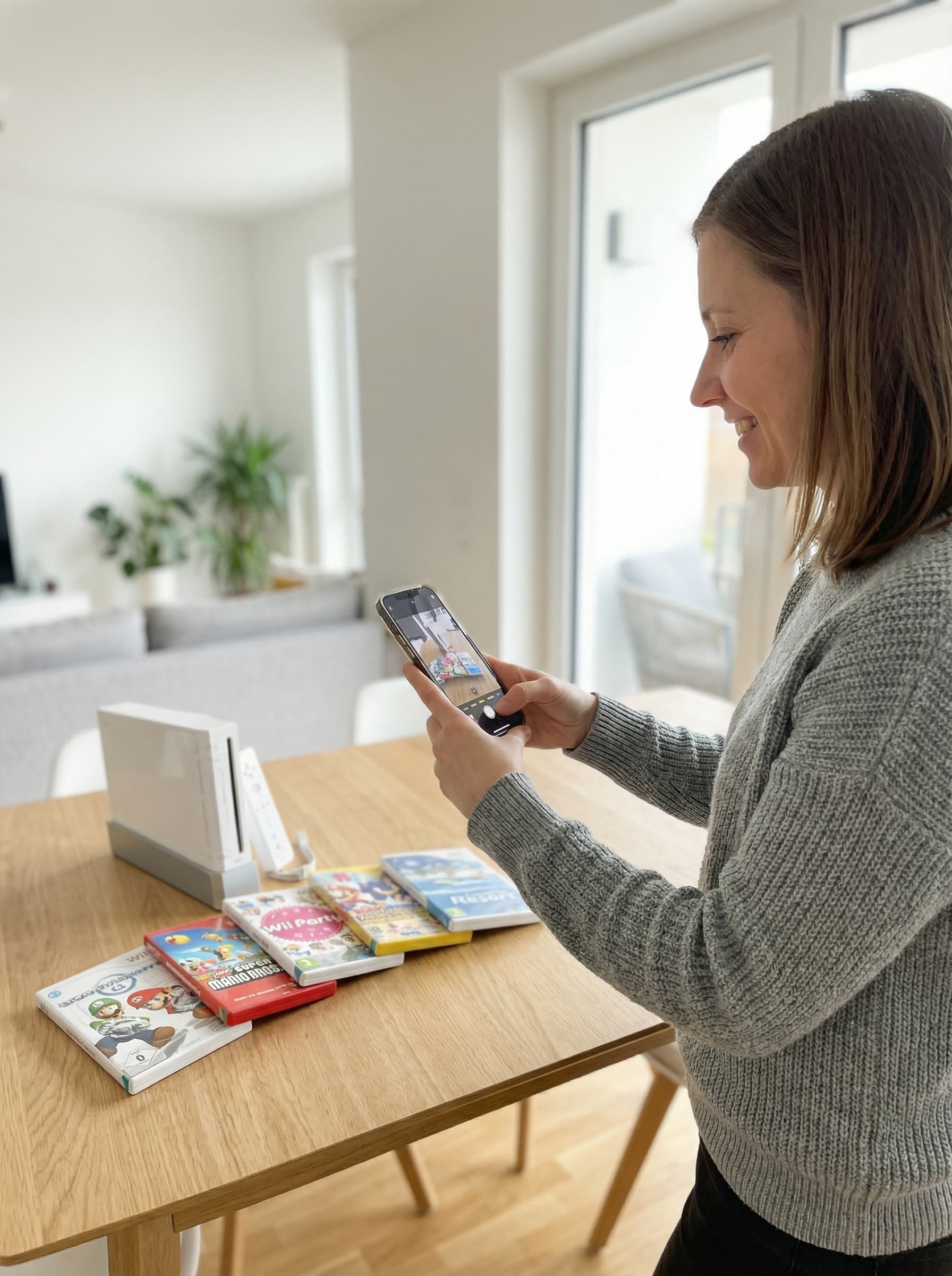 Person fotografiert eine Wii Sammlung